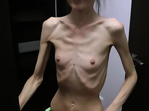 Half-starved Denisa posing mass far up has ribs moved